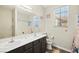 Bright bathroom featuring double sinks, modern fixtures, and decorative starfish at 5832 Ivy Vine Ct, Las Vegas, NV 89141