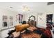 Bright bedroom featuring a double door that leads to a balcony, dresser, and an organized closet at 5832 Ivy Vine Ct, Las Vegas, NV 89141