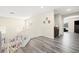 Upstairs hallway features modern gray floors and white railings overlooking the living area at 5832 Ivy Vine Ct, Las Vegas, NV 89141