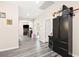 Upstairs hallway features modern gray floors that lead to various rooms with archways at 5832 Ivy Vine Ct, Las Vegas, NV 89141