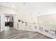 Upstairs hallway features modern gray floors, white railings, and natural light at 5832 Ivy Vine Ct, Las Vegas, NV 89141