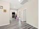 Upstairs hallway features modern gray floors that lead to various rooms at 5832 Ivy Vine Ct, Las Vegas, NV 89141