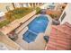 Aerial view of a private pool, patio, and lush landscaping in a backyard perfect for entertaining and relaxation at 5832 Ivy Vine Ct, Las Vegas, NV 89141