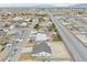 Aerial view of desert community with new homes and mountain views in distance at 6360 Montclair St, Pahrump, NV 89061