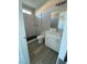 Stylish bathroom featuring a marble-tiled shower, modern vanity, and contemporary finishes at 6360 Montclair St, Pahrump, NV 89061