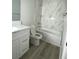 Elegant bathroom featuring a marble-tiled shower, modern vanity, and contemporary finishes at 6360 Montclair St, Pahrump, NV 89061