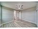 Bedroom with luxury vinyl plank flooring, a ceiling fan, and ensuite bathroom at 6360 Montclair St, Pahrump, NV 89061