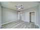 Bedroom with a ceiling fan, two closets, and luxury vinyl plank flooring at 6360 Montclair St, Pahrump, NV 89061