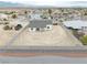 An elevated view reveals the home's backyard landscaping, new construction and proximity to neighboring properties at 6360 Montclair St, Pahrump, NV 89061