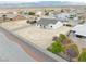 Aerial view captures the home's backyard, new fence and landscaping, with construction equipment nearby at 6360 Montclair St, Pahrump, NV 89061