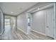 View of the hallway featuring luxury vinyl plank flooring and neutral paint at 6360 Montclair St, Pahrump, NV 89061