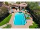 Aerial view of pool, spa, patio and lush backyard oasis at 6391 Tempting Choice Ave, Las Vegas, NV 89131