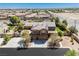 Aerial view of beautiful two-story home with a three car garage and solar panels at 6391 Tempting Choice Ave, Las Vegas, NV 89131