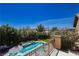 Backyard aerial view showcases a sparkling pool, hot tub, lush landscaping, and patio area at 6391 Tempting Choice Ave, Las Vegas, NV 89131