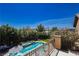 An aerial view from the balcony overlooking a pool, spa, and lush landscaping at 6391 Tempting Choice Ave, Las Vegas, NV 89131