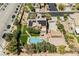 Aerial view of the property showing the pool, bocce ball court, solar panels, and lush landscaping at 6391 Tempting Choice Ave, Las Vegas, NV 89131