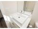 Modern bathroom features a sleek vessel sink, chrome faucet, and white cabinetry at 6391 Tempting Choice Ave, Las Vegas, NV 89131