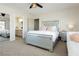 Bright bedroom showcasing a comfortable bed and adjacent bathroom at 6391 Tempting Choice Ave, Las Vegas, NV 89131