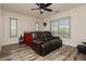 Bedroom featuring luxury vinyl flooring and natural light at 6391 Tempting Choice Ave, Las Vegas, NV 89131