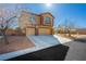 Charming two-story home featuring a three car garage and manicured landscaping at 6391 Tempting Choice Ave, Las Vegas, NV 89131