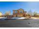 Charming two-story home featuring a three car garage and manicured landscaping at 6391 Tempting Choice Ave, Las Vegas, NV 89131