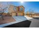 Lovely two-story home showcasing a three-car garage and drought-tolerant landscaping at 6391 Tempting Choice Ave, Las Vegas, NV 89131