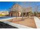 Inviting two-story home with a three-car garage and drought-tolerant landscaping at 6391 Tempting Choice Ave, Las Vegas, NV 89131