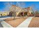 Charming two-story home with a well-maintained front yard and three-car garage at 6391 Tempting Choice Ave, Las Vegas, NV 89131