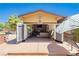 Charming outdoor lodge with a cozy fireplace, comfortable seating, and a welcoming bar area at 6391 Tempting Choice Ave, Las Vegas, NV 89131