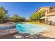 Beautiful pool area with lush landscaping and string lights at 6391 Tempting Choice Ave, Las Vegas, NV 89131