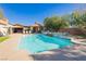 Sparkling pool with waterfall feature, set in a lush backyard, perfect for outdoor enjoyment at 6391 Tempting Choice Ave, Las Vegas, NV 89131