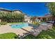 Inviting backyard pool area with lush landscaping and patio seating, perfect for outdoor relaxation and entertaining at 6391 Tempting Choice Ave, Las Vegas, NV 89131