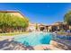 Home boasts a beautiful pool with well-manicured landscaping and great views at 6391 Tempting Choice Ave, Las Vegas, NV 89131