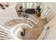 Open staircase features white railings and wood floors, leading to the second level of the home at 6391 Tempting Choice Ave, Las Vegas, NV 89131