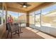 Relaxing sunroom with views of the lushly landscaped backyard at 6391 Tempting Choice Ave, Las Vegas, NV 89131