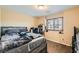 Cozy bedroom with carpeted floor, natural light, and neutral walls with queen bed at 6629 Breakwater Reef St, Las Vegas, NV 89149