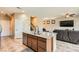 Open kitchen with an island and stainless appliances flowing into the living area at 6629 Breakwater Reef St, Las Vegas, NV 89149