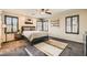 Light-filled bedroom with dark trim windows, modern shelving, and a comfortable king-sized bed at 6629 Breakwater Reef St, Las Vegas, NV 89149