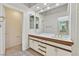 Bright bathroom with double sink vanity, large mirror, and tile flooring at 6959 Emerald Springs Ln, Las Vegas, NV 89113