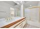 Bathroom featuring a double vanity, large mirror, and a separate shower/tub at 6959 Emerald Springs Ln, Las Vegas, NV 89113