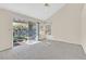 Light-filled bedroom with serene pond view from sliding glass door at 6959 Emerald Springs Ln, Las Vegas, NV 89113