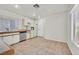 Bright kitchen with tile floors, white cabinets, stainless steel dishwasher, and lots of natural light at 6959 Emerald Springs Ln, Las Vegas, NV 89113