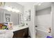 This bathroom features a single sink, a framed mirror, a shower/tub and a toilet at 6989 Walden Park St, Las Vegas, NV 89166