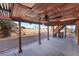 A covered patio offers an outdoor living space with concrete floor and ceiling fan at 706 Morrocco Dr, Henderson, NV 89002