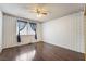 Inviting bedroom with a ceiling fan, natural light, and sleek flooring at 706 Morrocco Dr, Henderson, NV 89002