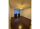 A cozy bedroom features hardwood floors and a ceiling fan at 706 Morrocco Dr, Henderson, NV 89002