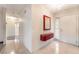 Well-lit foyer featuring neutral walls, tile floors, and a decorative mirror at 706 Morrocco Dr, Henderson, NV 89002