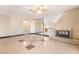 Spacious living room featuring a fireplace, tile flooring, and large windows at 706 Morrocco Dr, Henderson, NV 89002