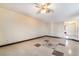 Spacious living room featuring tile flooring and a ceiling fan at 706 Morrocco Dr, Henderson, NV 89002