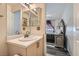 Bathroom with a view to the bedroom, a white countertop, and a double mirror at 7632 Amato Ave, Las Vegas, NV 89128